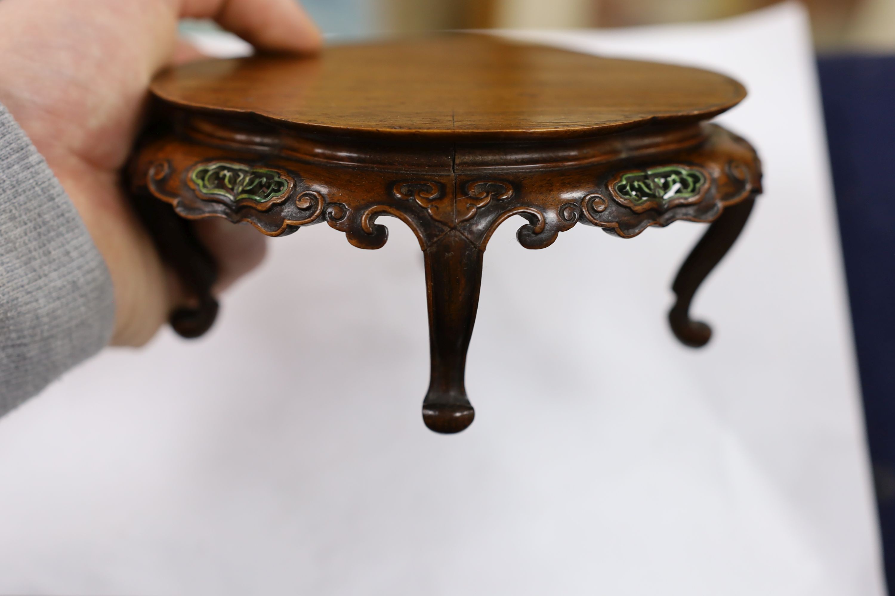 A fine Chinese oval hardwood and green stained Ivory inset stand, Qing dynasty, lacking stretcher, 15 cms wide.